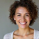 Portrait of Emily R., a woman radiating happiness and well-being, reflecting a successful health transformation with Healthy Habits Hub.